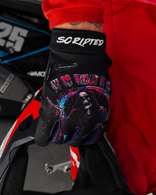 Close up shot of a black Scripted Glove with colourful graphic "It is what it is"
