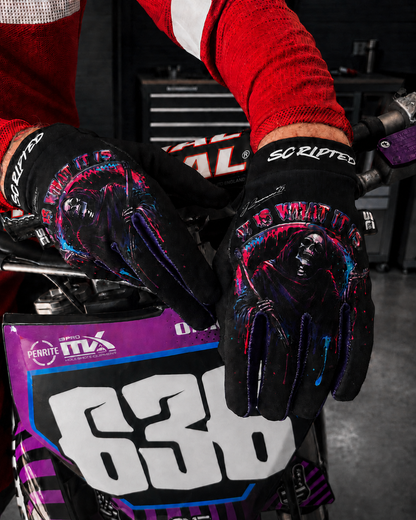 Model wearing Scripted JZ Reaper Gloves with hands positioned on a motobike
